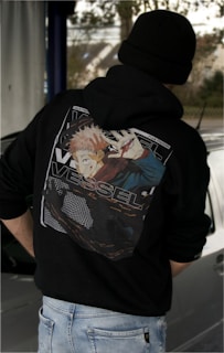 a person wearing a black hoodie