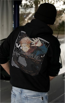 a person wearing a black hoodie