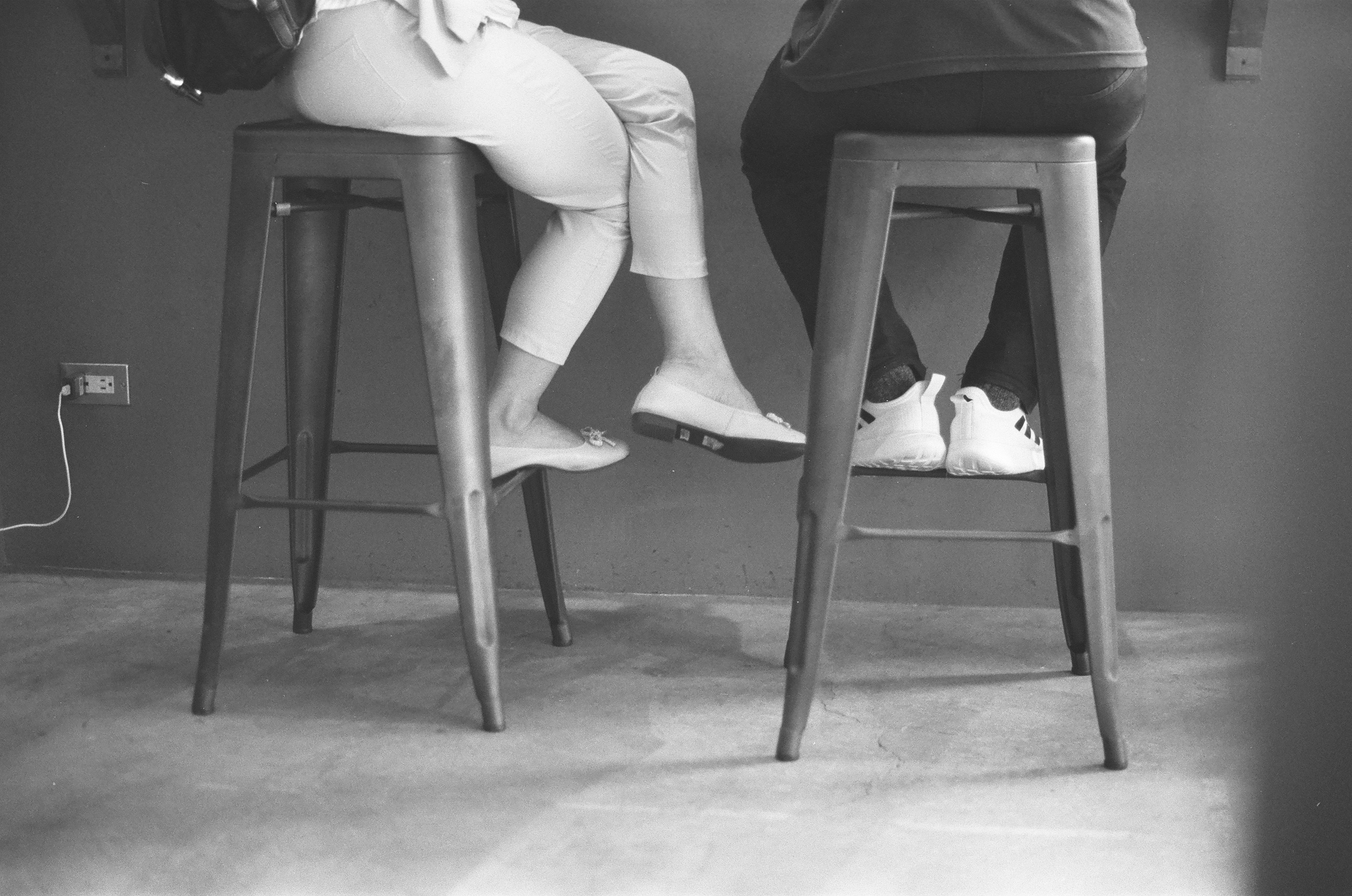 a woman sitting on a stool