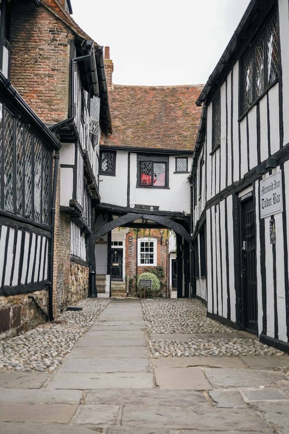 a cobblestone street between buildings