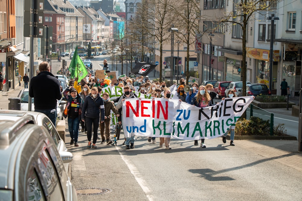 a group of people marching in the street