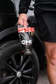 a man holding a can