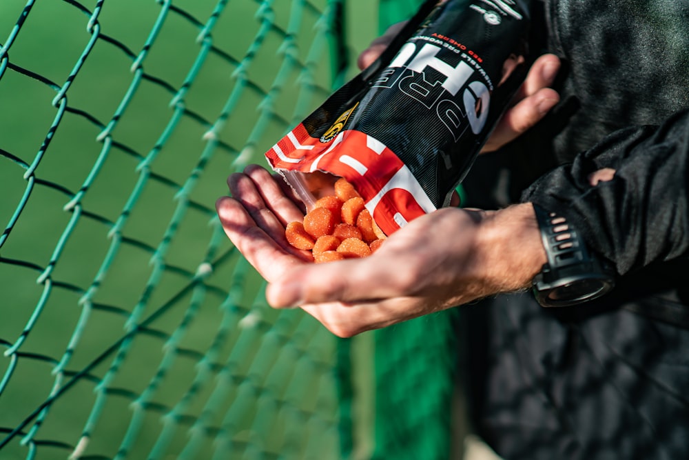 a person holding a bag of candy