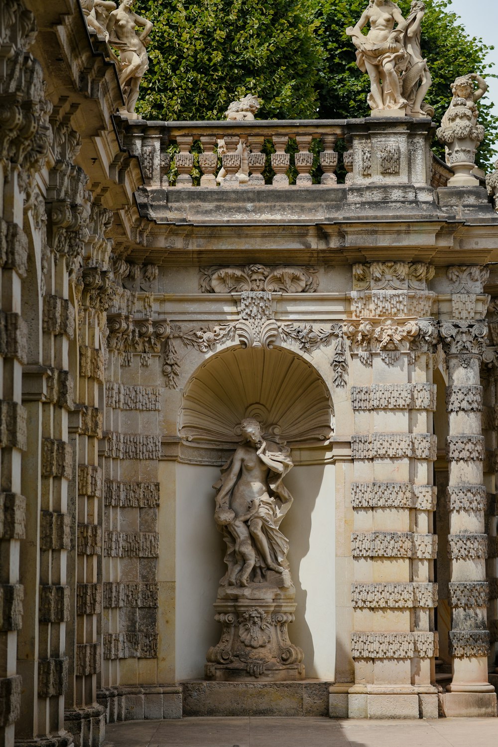 a stone building with statues