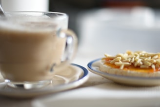a plate of food next to a mug of coffee