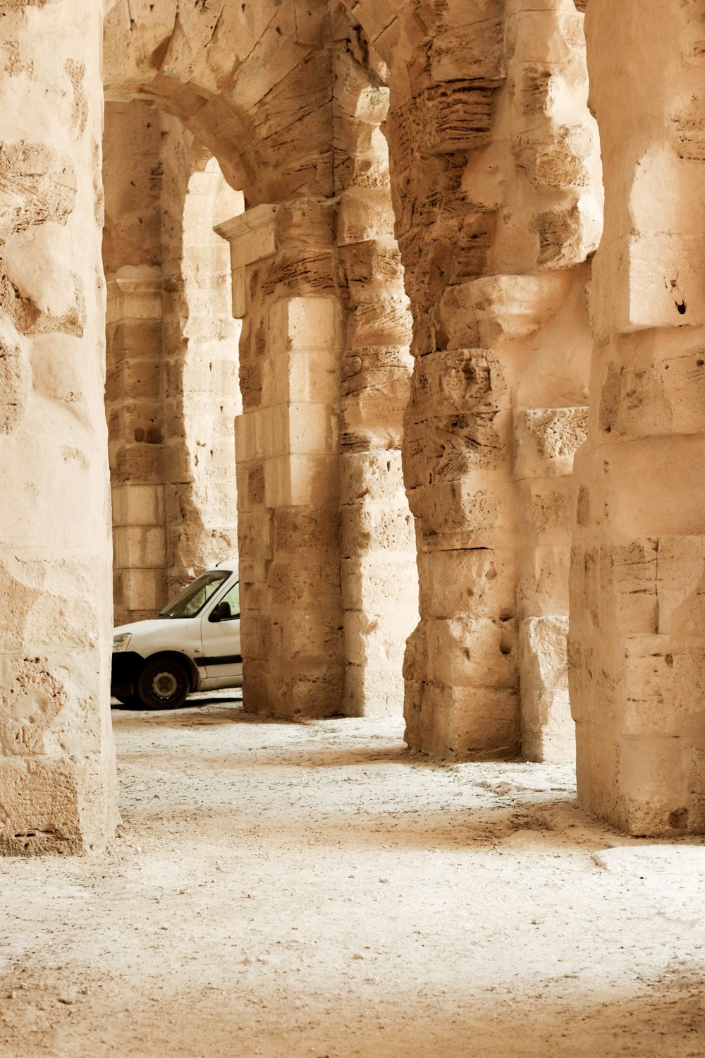 a car parked in a large stone building