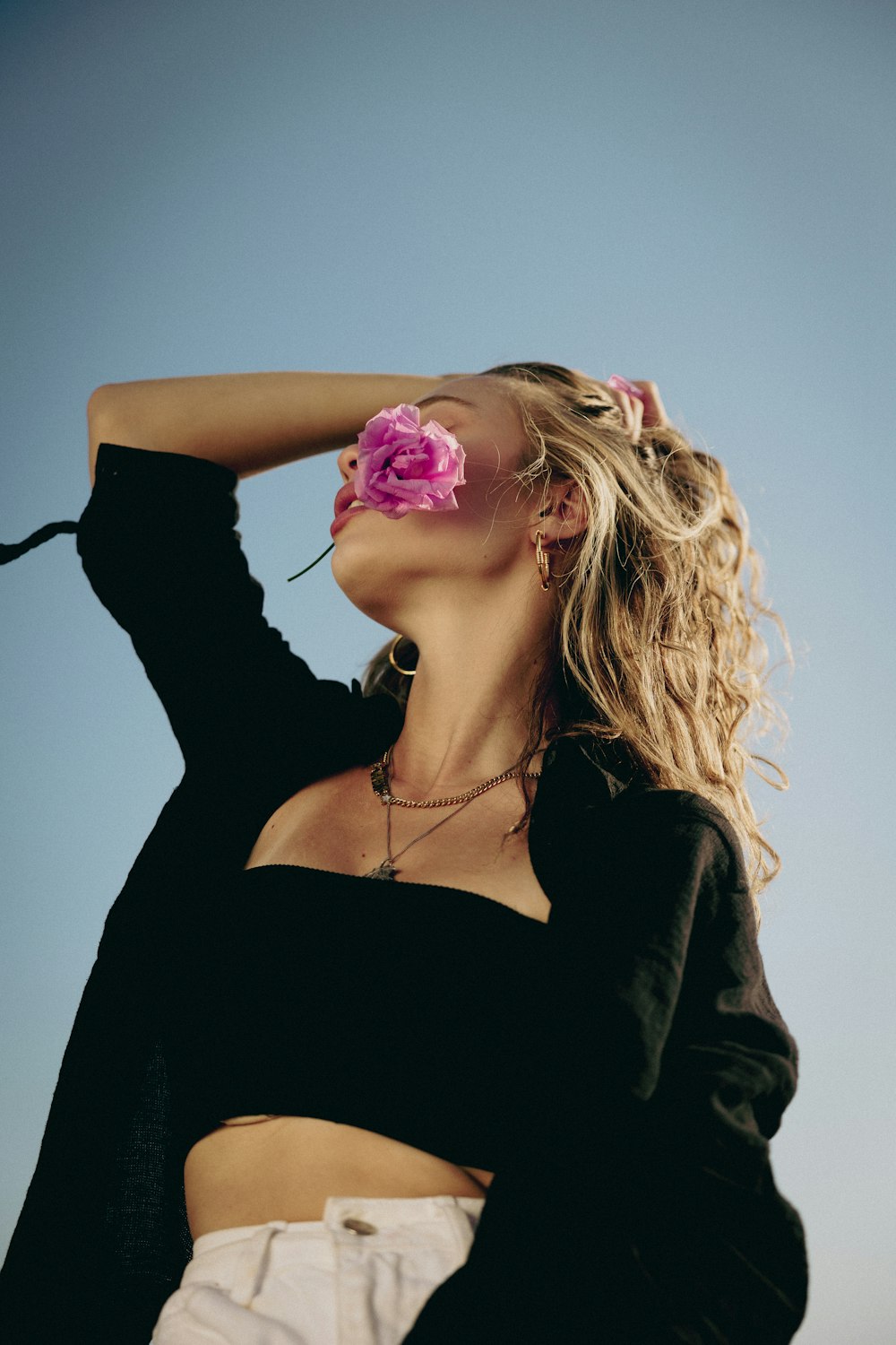 a woman with a flower in her hair