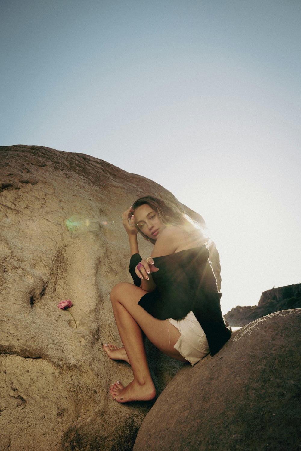 a man sitting on a rock