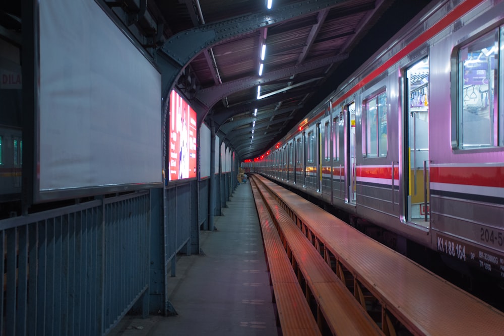 a train station with a bench