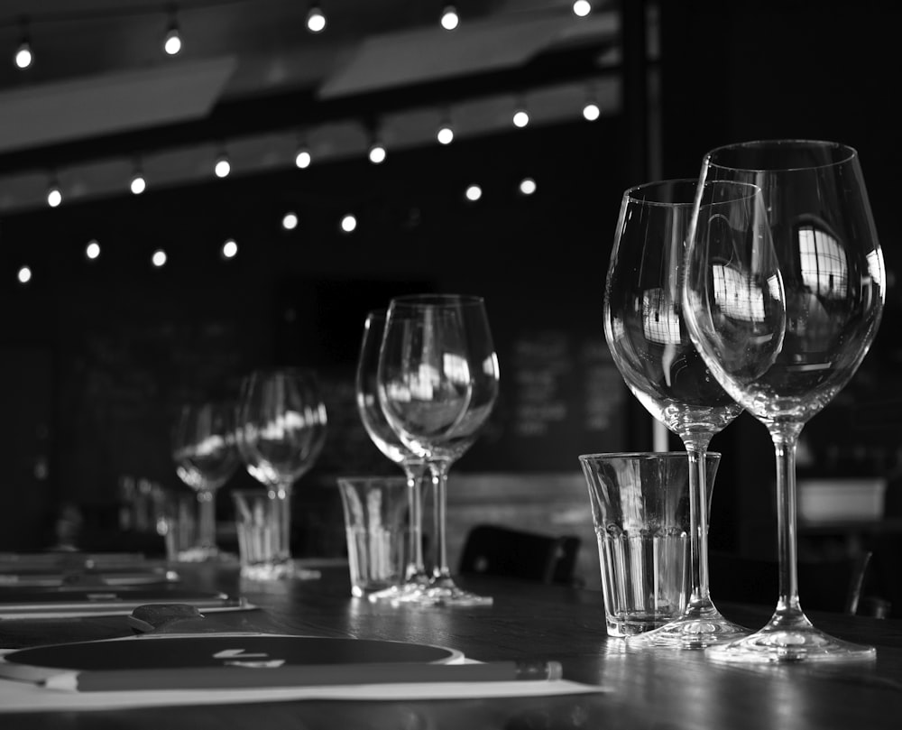 a group of wine glasses on a table