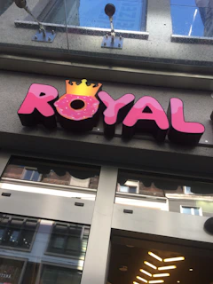 A vibrant photo of Roy Enterprise storefront with fintech service icons displayed.