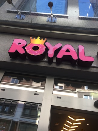Exterior view of a Don Ferre store showing the bold red and blue brand colors on signage.