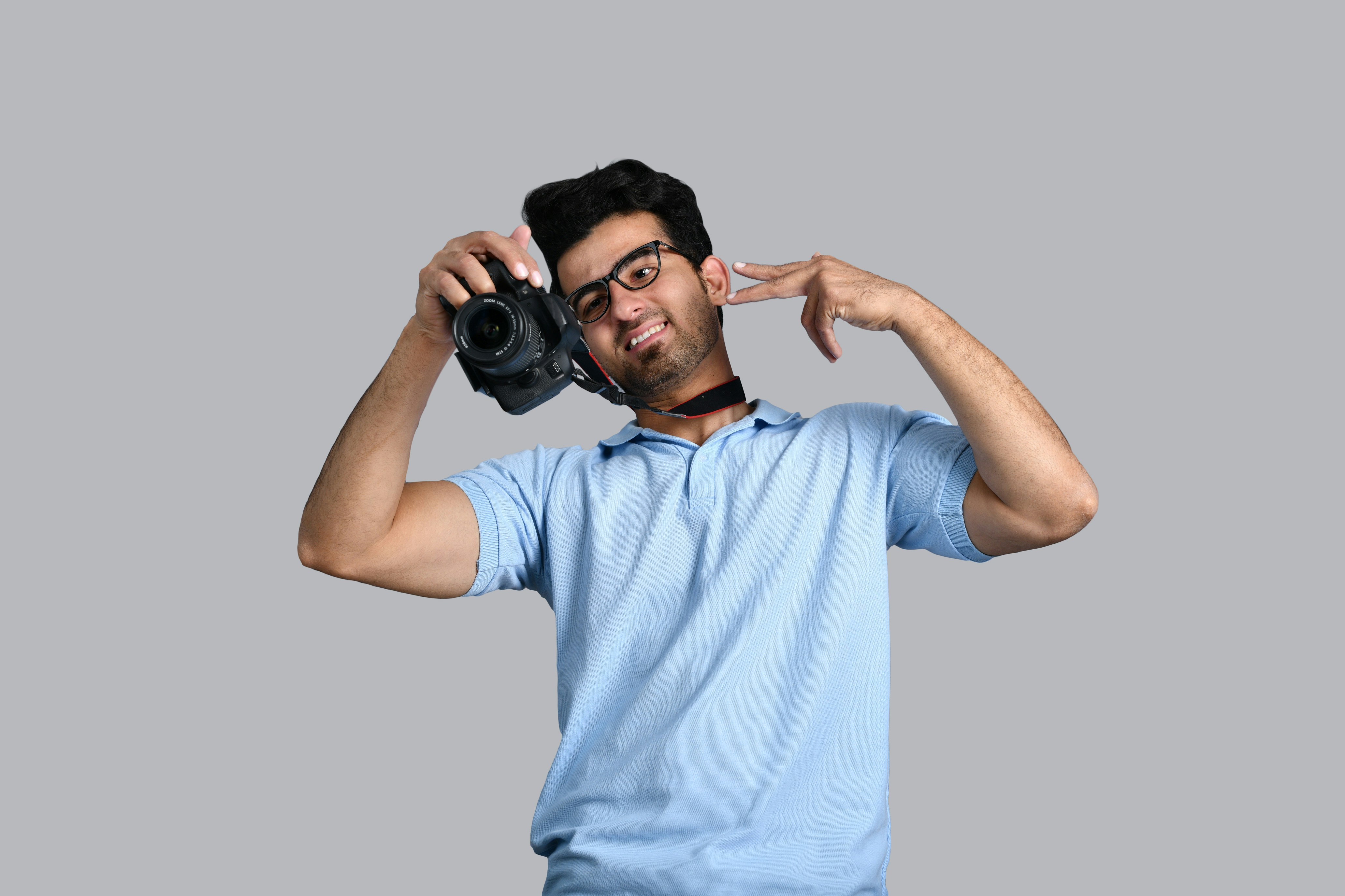 A man holding a camera photo – Free Human Image on Unsplash