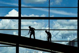 a few men working on a building
