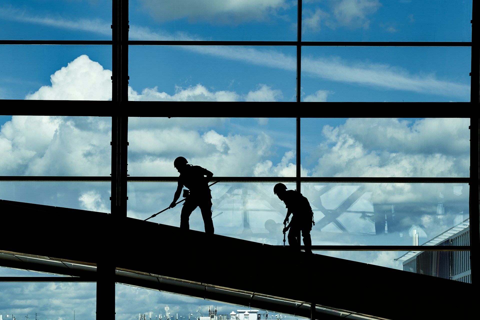 a few men working on a building
