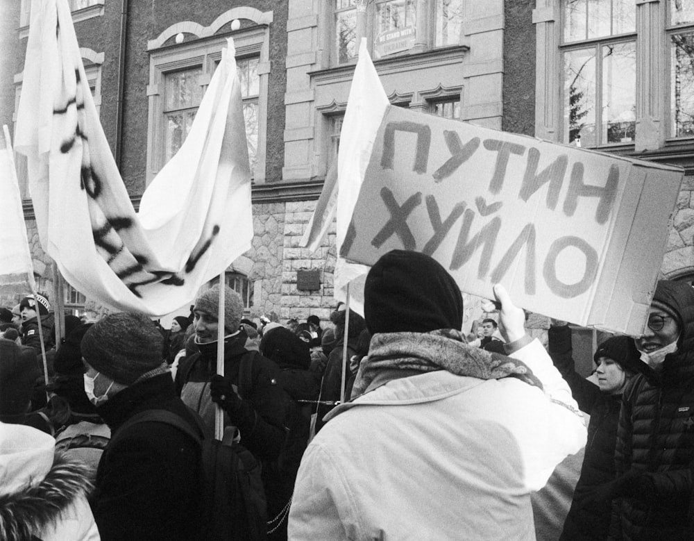 a group of people holding signs