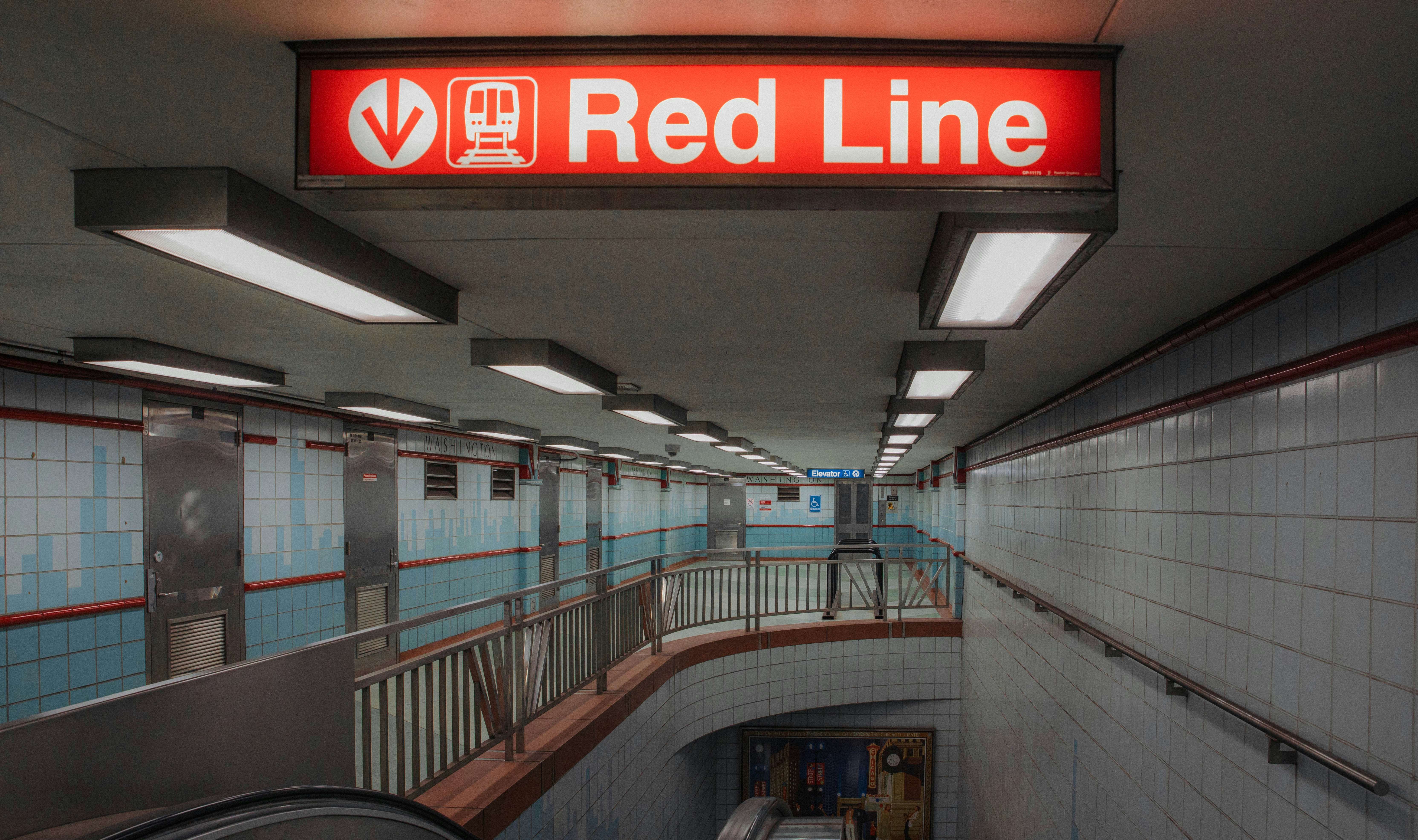 A metro station with a prominent sign with an arrow reading "Red Line"