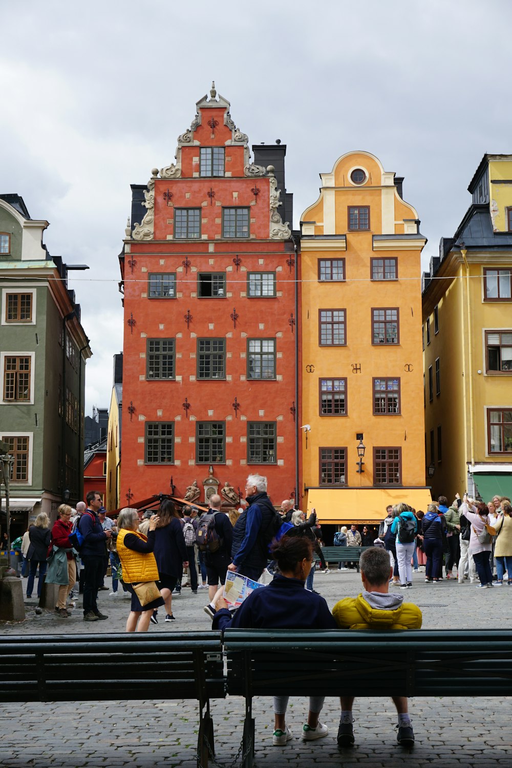 a group of people standing outside Gamla stan