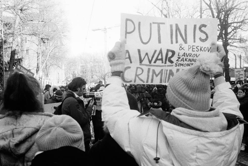 a group of people holding a sign