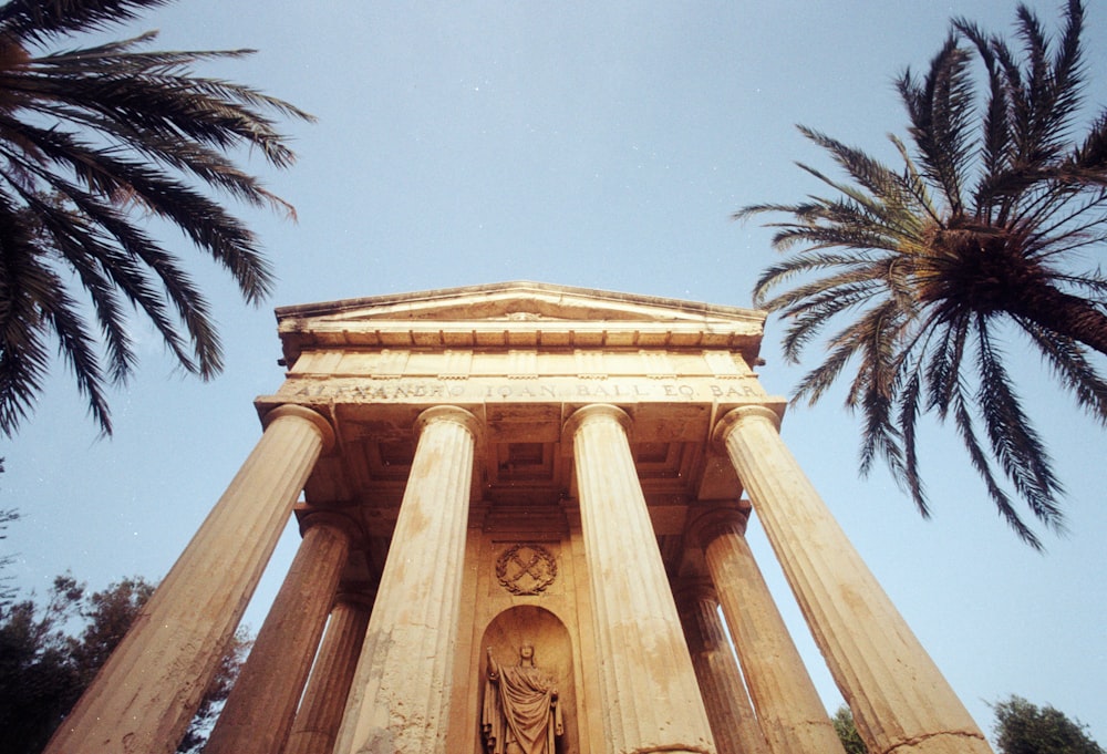 a building with columns and a statue