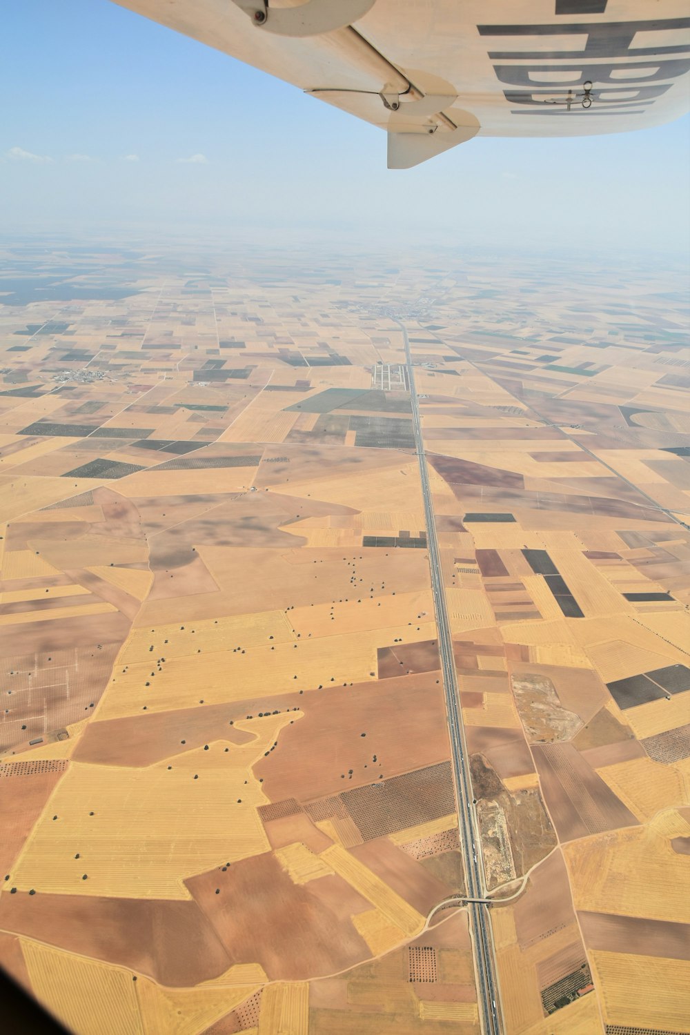 an airplane wing in the sky