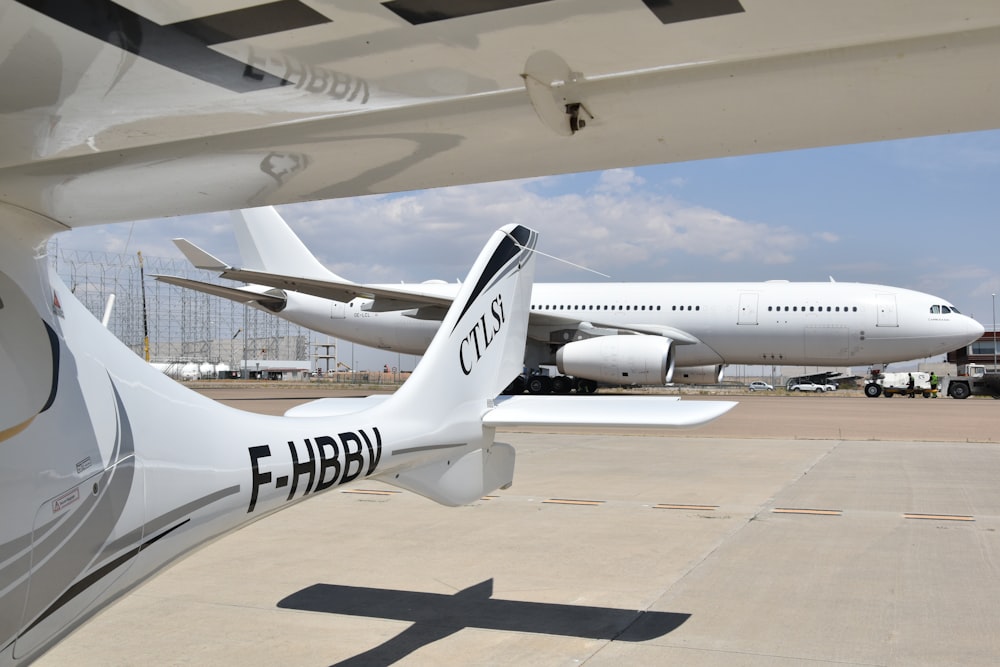 a large white airplane is parked at an airport
