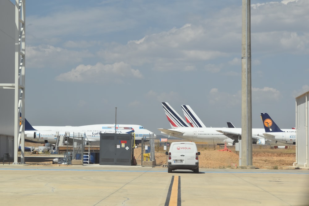 a couple of airplanes at an airport