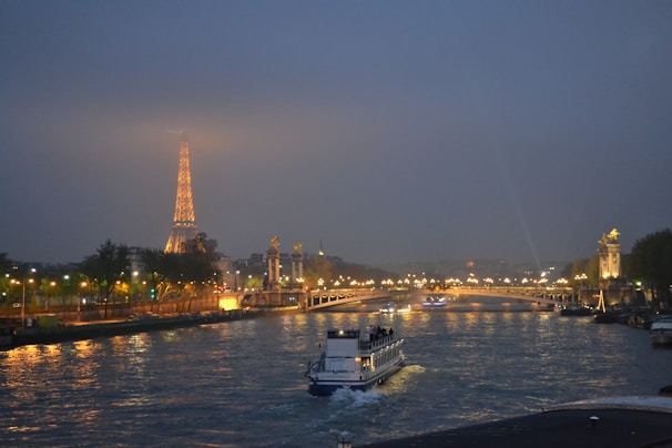 a boat on the water with a city in the background