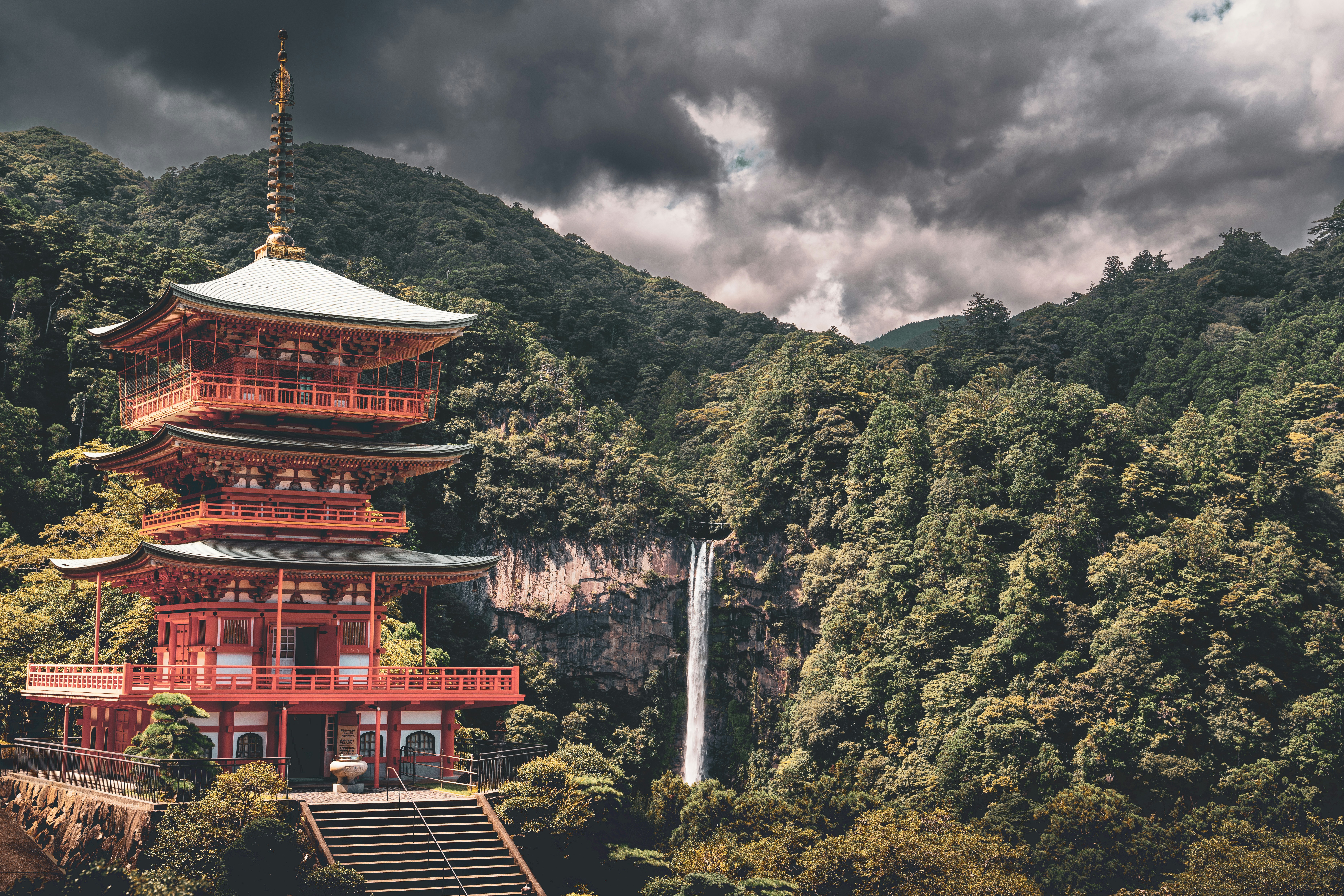 a building with a tower and trees in the back