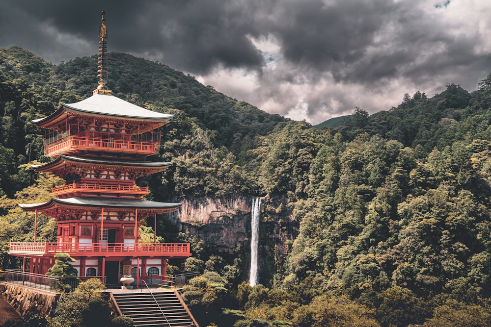 a building with a tower and trees in the back