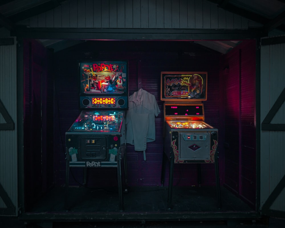 a person standing in a room with arcade games