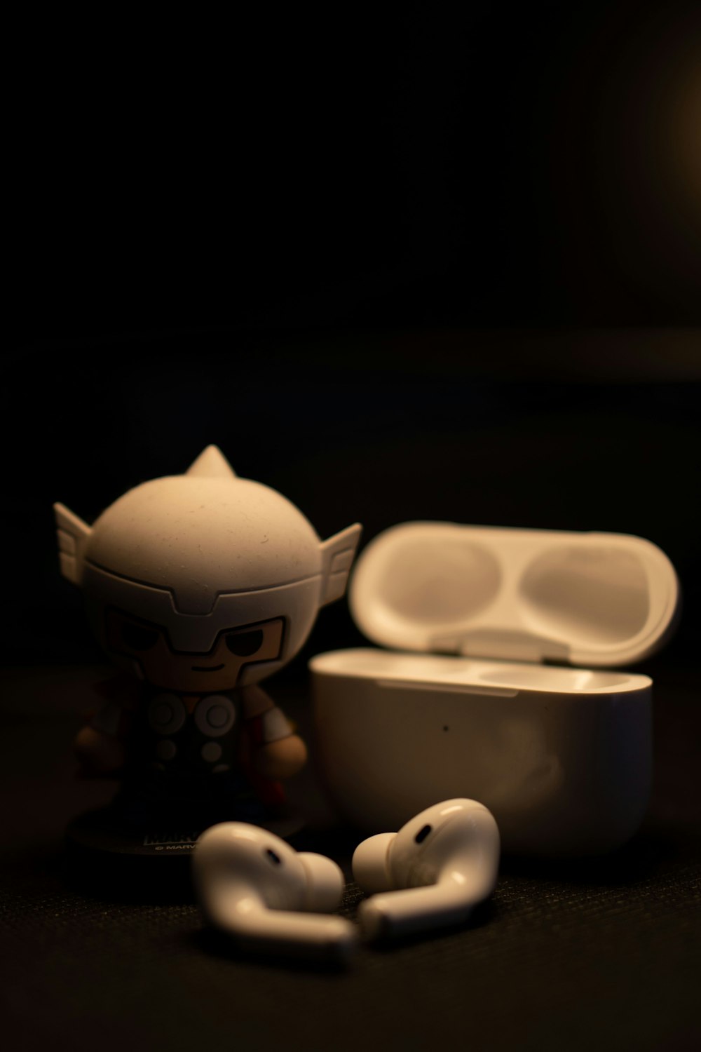 a toy figurine next to some white objects