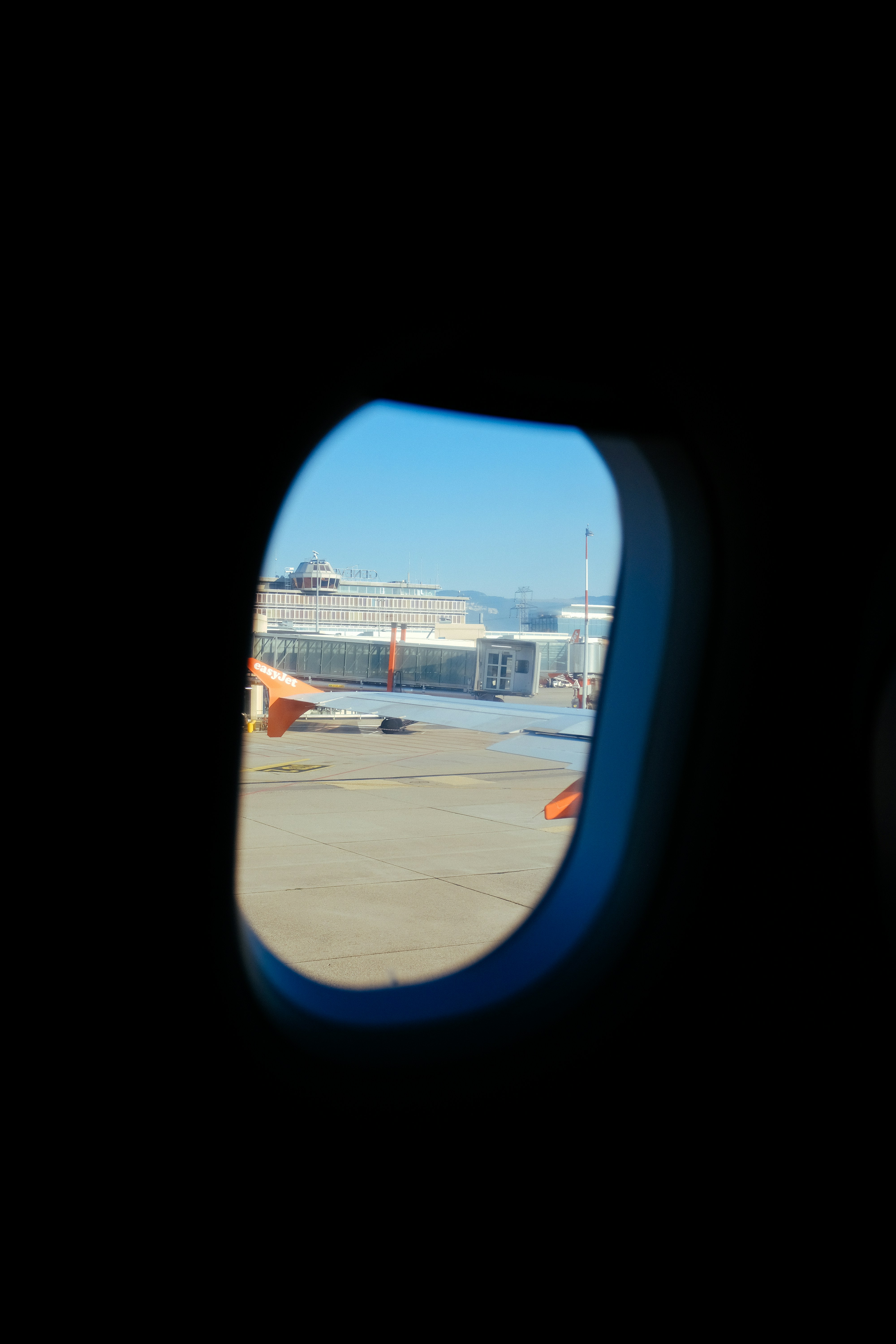 A view of a port from an airplane window photo – Free Blue Image on ...