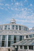 Architectural blueprint style illustration merging greenhouse structure with data science interface elements.