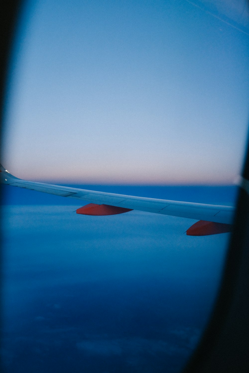 an airplane wing in the sky