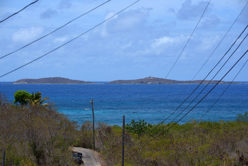 a road next to a body of water