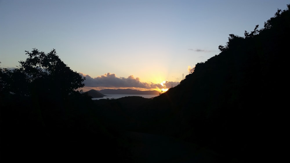 a view of a sunset over a mountain range