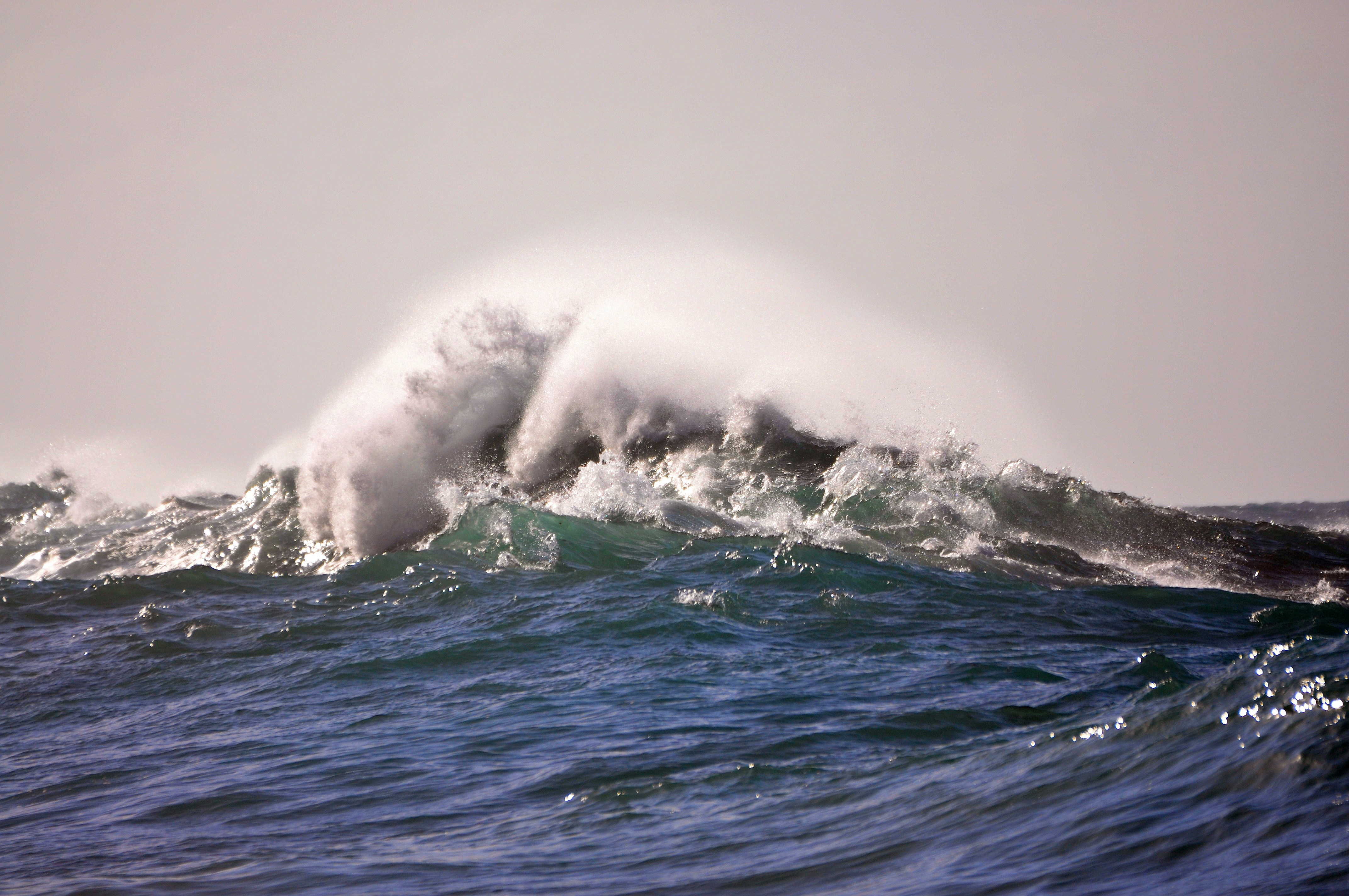 a wave crashing on a beach