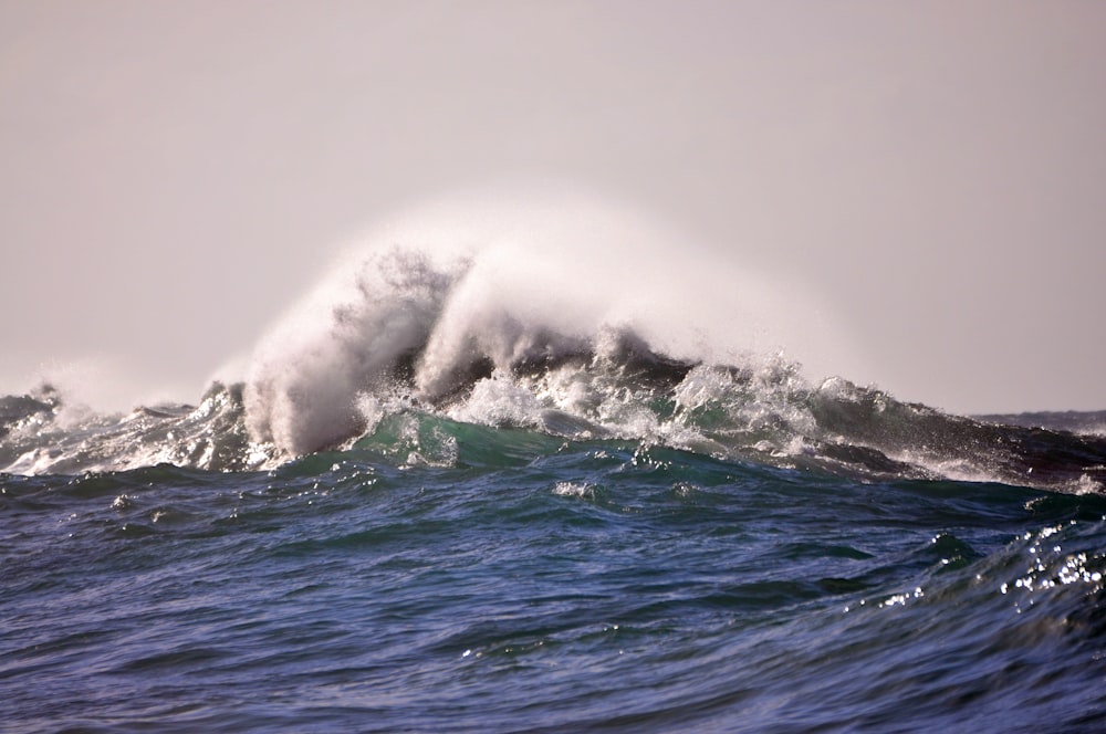 a wave crashing on a beach