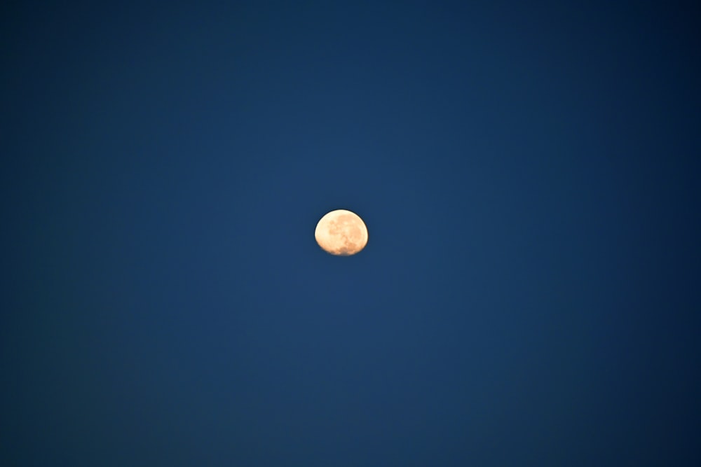 a moon in a blue sky
