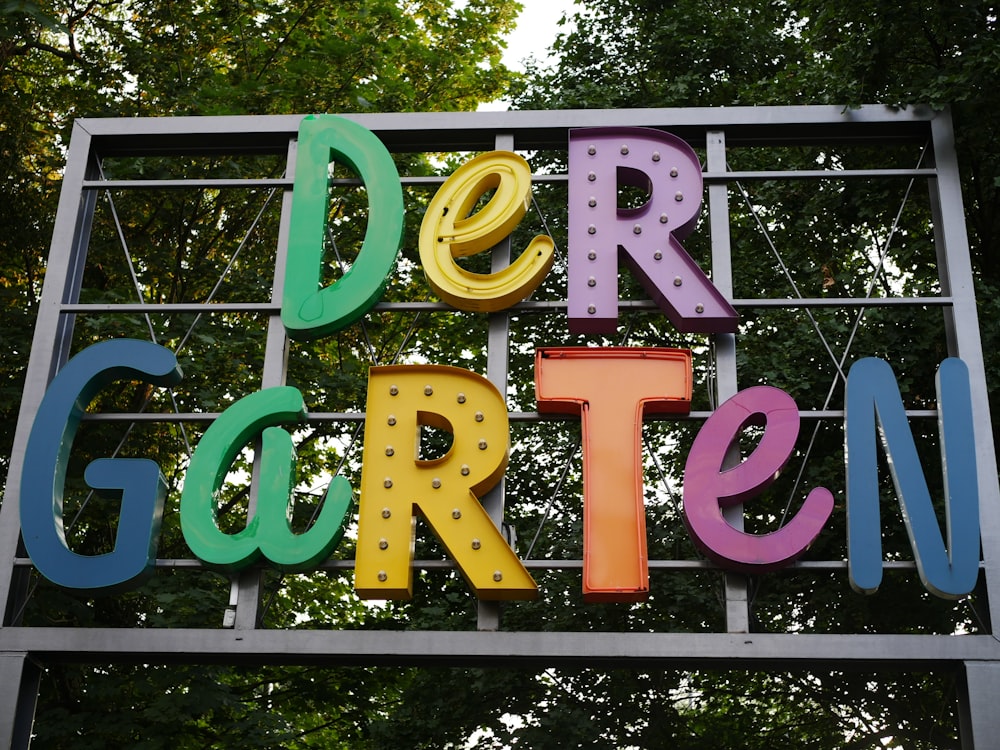 a sign with colorful letters