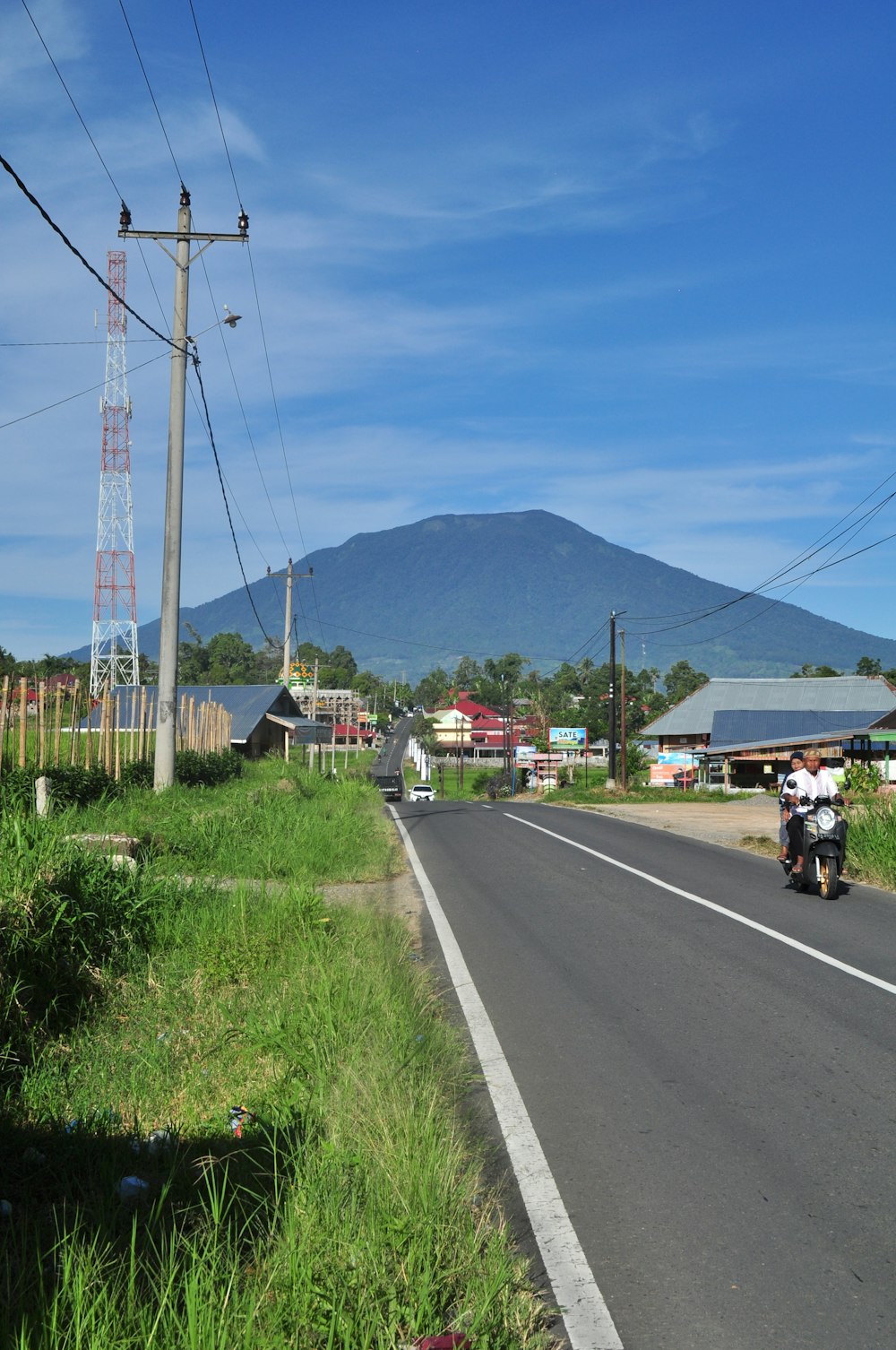 a person riding a motorcycle down a road