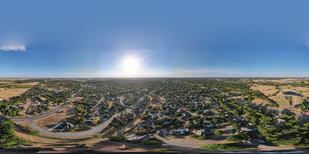 a landscape with a road and buildings