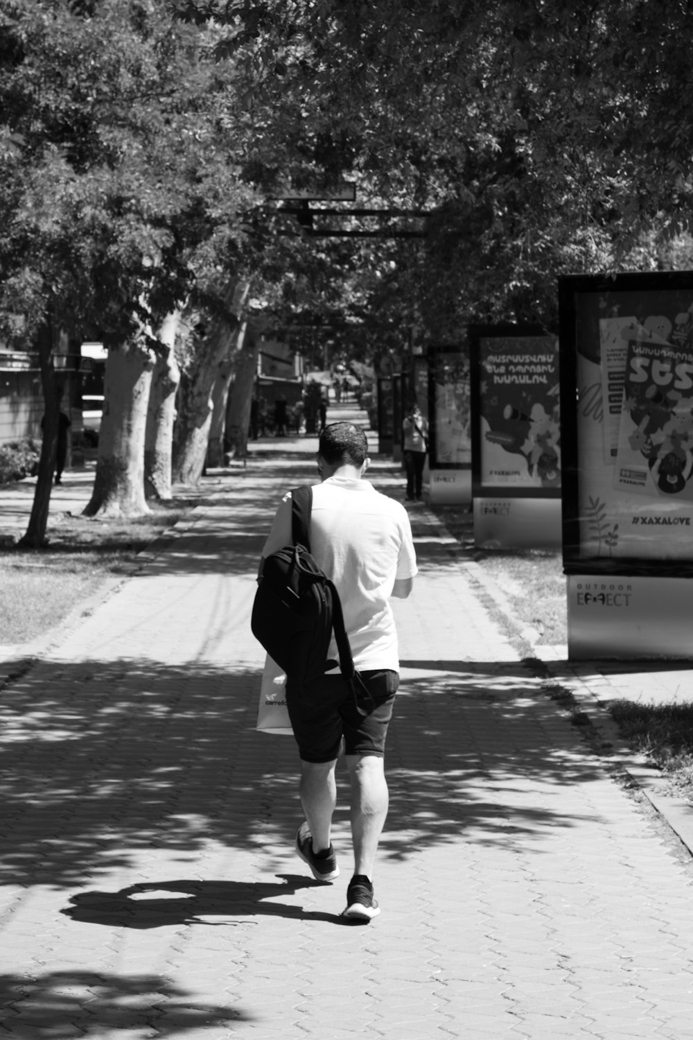 a person walking down a sidewalk