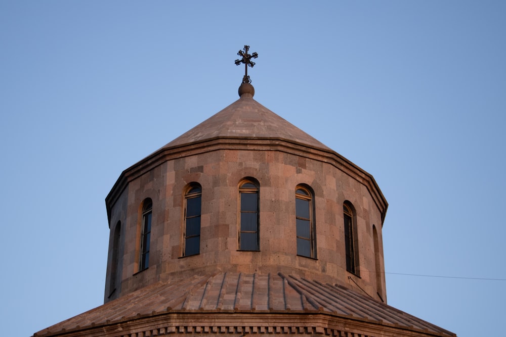 a building with a statue on top