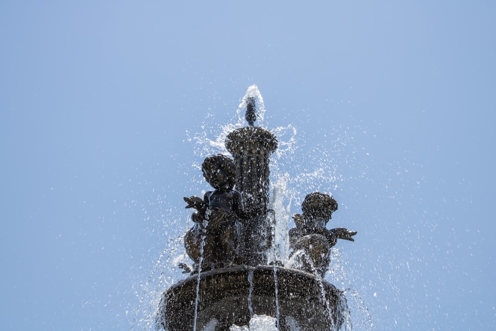 a statue of a man and a woman on a rock