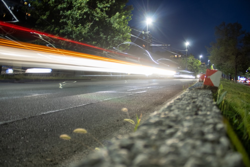 a car driving down a road at night