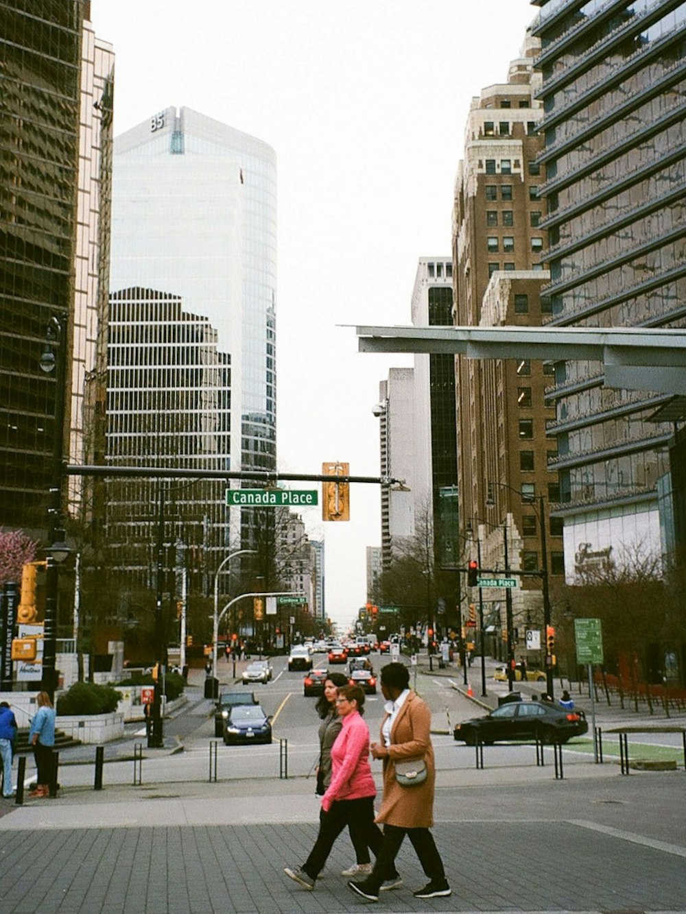 people walking on the sidewalk