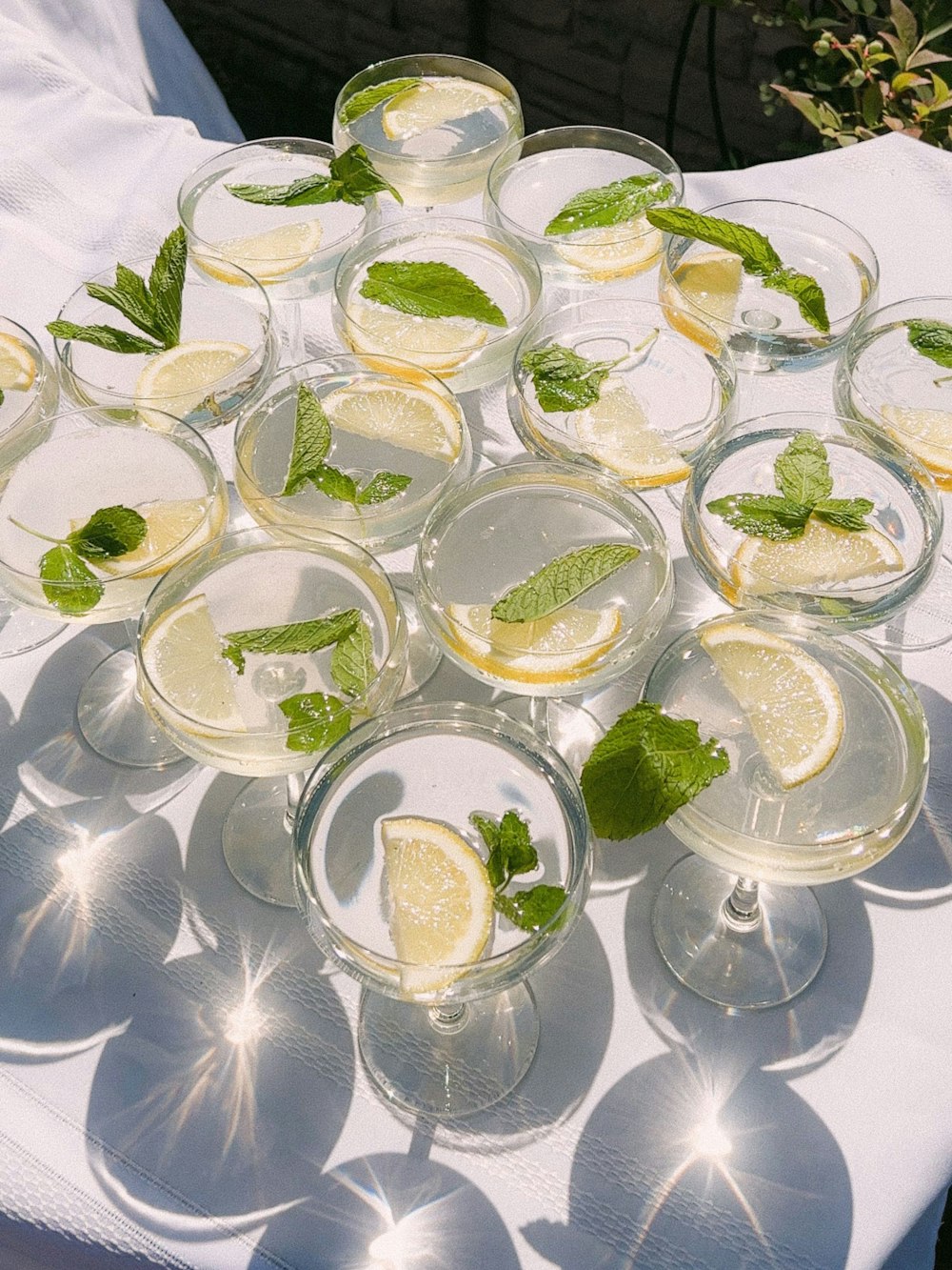 a group of glasses with limes