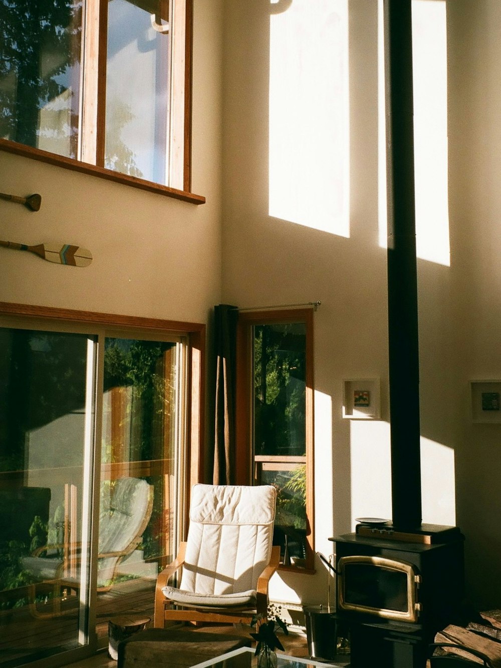 a living room with a chair and television